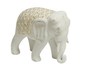 Biała drewniana figurka słonia.